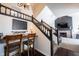 View of the staircase and living room with fireplace in the background at 6149 W Country Ln, Anderson, IN 46011