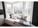 Charming window seat with plush cushions offering a cozy spot to relax and enjoy the outdoor view at 6149 W Country Ln, Anderson, IN 46011