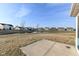 Scenic backyard with a concrete patio, lawn, and a pond beyond at 6216 N Woods Edge Ct, McCordsville, IN 46055