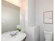 Modern powder room with elegant fixtures, stylish mirror, and a clean, minimalist design at 6216 N Woods Edge Ct, McCordsville, IN 46055