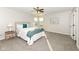 Bright bedroom featuring a ceiling fan, two windows, and neutral-toned walls and carpet at 6216 N Woods Edge Ct, McCordsville, IN 46055