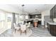 Charming dining area adjacent to kitchen, featuring stylish lighting and a welcoming atmosphere at 6216 N Woods Edge Ct, McCordsville, IN 46055