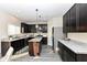 Modern kitchen with sleek cabinetry, stainless steel appliances, and a functional island for meal preparation at 6216 N Woods Edge Ct, McCordsville, IN 46055