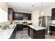 Well-lit kitchen featuring stainless steel appliances, stylish countertops, and ample cabinet space at 6216 N Woods Edge Ct, McCordsville, IN 46055