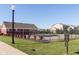 Community pool for residents' use with a building and manicured landscaping at 6216 N Woods Edge Ct, McCordsville, IN 46055