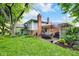 Charming backyard with a patio, mature trees, and an outdoor dining area at 629 Williamsburg Ln, Greenwood, IN 46142
