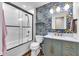 Stylish bathroom with shower, vanity and sink and decorative wallpaper at 629 Williamsburg Ln, Greenwood, IN 46142