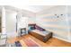 Bedroom with hardwood floors, a twin bed, a desk and neutral paint with tree-themed decals at 629 Williamsburg Ln, Greenwood, IN 46142