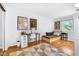 Bright bedroom features hardwood floors, stylish rug, desk and daybed at 629 Williamsburg Ln, Greenwood, IN 46142