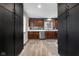 Well-lit kitchen boasts stainless steel appliances, wood cabinets, and neutral countertops at 629 Williamsburg Ln, Greenwood, IN 46142