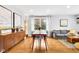 Open concept living space with a dining area, hardwood floors, and stylish furnishings at 629 Williamsburg Ln, Greenwood, IN 46142