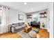Inviting living room featuring a comfortable sofa, stylish decor, and natural light at 629 Williamsburg Ln, Greenwood, IN 46142