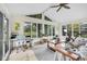 Bright sunroom with natural lighting from the surrounding windows at 629 Williamsburg Ln, Greenwood, IN 46142