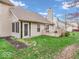 Expansive backyard view, highlighting the lawn, mature trees, and outdoor living space at 6556 Aintree Ter, Indianapolis, IN 46250