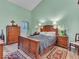 Spacious primary bedroom with vaulted ceiling, hardwood floors, and abundant natural light at 6556 Aintree Ter, Indianapolis, IN 46250