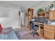 Comfortable bedroom area with a desk, closet, and a classic grandfather clock at 6556 Aintree Ter, Indianapolis, IN 46250