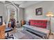 Cozy bedroom with natural light, a futon, and a decorative rug at 6556 Aintree Ter, Indianapolis, IN 46250
