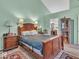 A well-lit primary bedroom offers ample space and views of the adjacent primary bathroom at 6556 Aintree Ter, Indianapolis, IN 46250