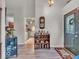 Welcoming entryway with a view into the kitchen, offering a glimpse of the home's layout and design at 6556 Aintree Ter, Indianapolis, IN 46250
