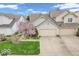 Charming home exterior with a two-car garage and a well-maintained front yard at 6556 Aintree Ter, Indianapolis, IN 46250