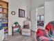Comfortable living space featuring a bookshelf, recliner, and natural light streaming through the window at 6556 Aintree Ter, Indianapolis, IN 46250