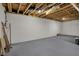 Unfinished basement area, ready for customization, with exposed beams and a neutral gray floor at 6806 Powder Dr, Indianapolis, IN 46259