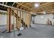 Unfinished basement with exposed wooden beams, providing a blank canvas for customization and future development at 6806 Powder Dr, Indianapolis, IN 46259