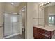 Bathroom featuring a glass-door shower and modern vanity with good lighting at 6806 Powder Dr, Indianapolis, IN 46259