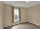 Bedroom with window view, neutral carpet and walls at 6806 Powder Dr, Indianapolis, IN 46259