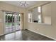 A dining area with sliding glass doors leading to an outdoor deck at 6806 Powder Dr, Indianapolis, IN 46259