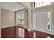 Bright entryway with hardwood floors, neutral walls, and an abundance of natural light at 6806 Powder Dr, Indianapolis, IN 46259