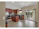 A kitchen with stainless steel appliances, a center island and a sliding glass door at 6806 Powder Dr, Indianapolis, IN 46259