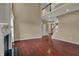 Living room featuring a fireplace, staircase, hardwood floors, and natural light at 6806 Powder Dr, Indianapolis, IN 46259