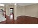 Spacious living room with hardwood floors, neutral walls, and an open layout to the entryway at 6806 Powder Dr, Indianapolis, IN 46259