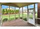 Screened porch featuring wood flooring with a view of the big backyard at 6806 Powder Dr, Indianapolis, IN 46259