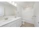 Modern bathroom featuring double sinks, a large mirror, and a shower-tub combination at 6848 Jacone Dr, Brownsburg, IN 46112