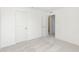 Bright bedroom features neutral carpet, a ceiling vent, and white doors leading to other rooms at 6848 Jacone Dr, Brownsburg, IN 46112