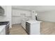 Modern, open kitchen with stainless-steel appliances, a large island, and abundant storage space at 6848 Jacone Dr, Brownsburg, IN 46112