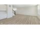 Bright, open living room with wood-style flooring, adjacent to the kitchen, providing ample space at 6848 Jacone Dr, Brownsburg, IN 46112