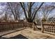 Spacious wood deck in backyard with trees and neighboring houses in background at 706 N Euclid Ave, Indianapolis, IN 46201
