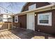Wood deck with access to backyard, brown siding and outdoor light fixture at 706 N Euclid Ave, Indianapolis, IN 46201