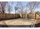 Spacious fenced backyard with a basketball hoop and an open gate at 706 N Euclid Ave, Indianapolis, IN 46201