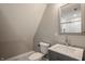 Bright bathroom with a gray vanity, white marble countertop, and sleek fixtures at 706 N Euclid Ave, Indianapolis, IN 46201