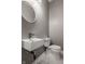 Modern powder room featuring a unique sink and updated fixtures at 706 N Euclid Ave, Indianapolis, IN 46201