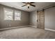 Bright bedroom with carpet floors, ceiling fan, and barn door closet at 706 N Euclid Ave, Indianapolis, IN 46201