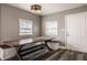 Dining room with large rustic table and built in bench and storage, and modern light fixture at 706 N Euclid Ave, Indianapolis, IN 46201