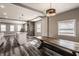 Inviting dining area with exposed stone accent wall and stylish overhead lighting at 706 N Euclid Ave, Indianapolis, IN 46201