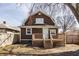 Home exterior featuring a wood deck with stairs and a yard at 706 N Euclid Ave, Indianapolis, IN 46201