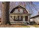 Charming brown two-story home with a cozy front porch and well-maintained yard at 706 N Euclid Ave, Indianapolis, IN 46201