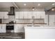 Spacious updated kitchen features stainless appliances, white cabinetry, island with breakfast bar at 706 N Euclid Ave, Indianapolis, IN 46201